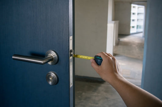 Measuring a BTO door edge before choosing a BTO digital lock in a Singapore HDB corridor